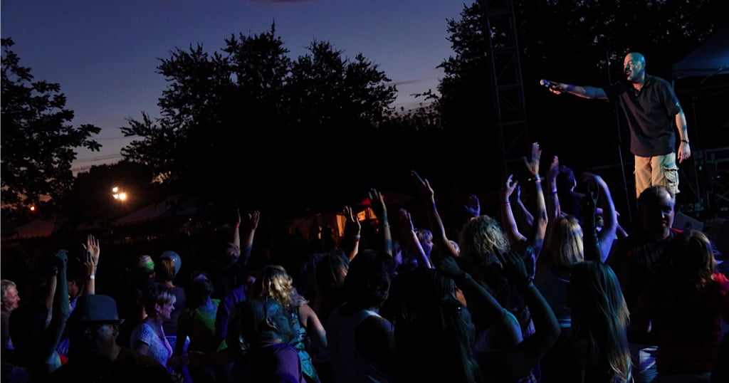 crowd at night watching Public Eye perform